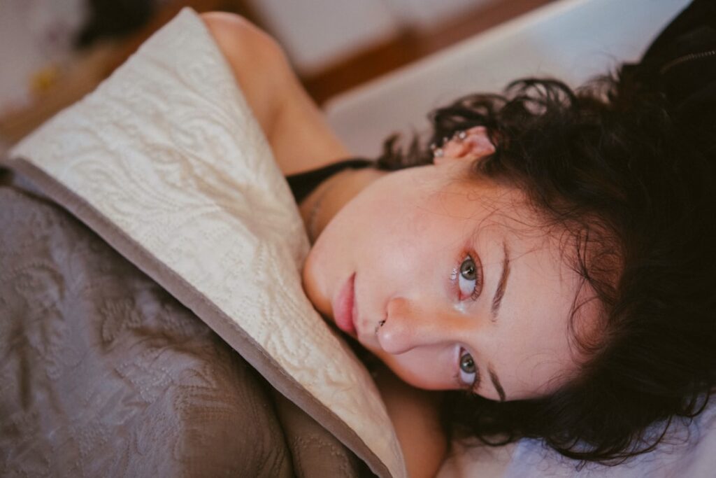 Woman resting in bed during menstrual discomfort